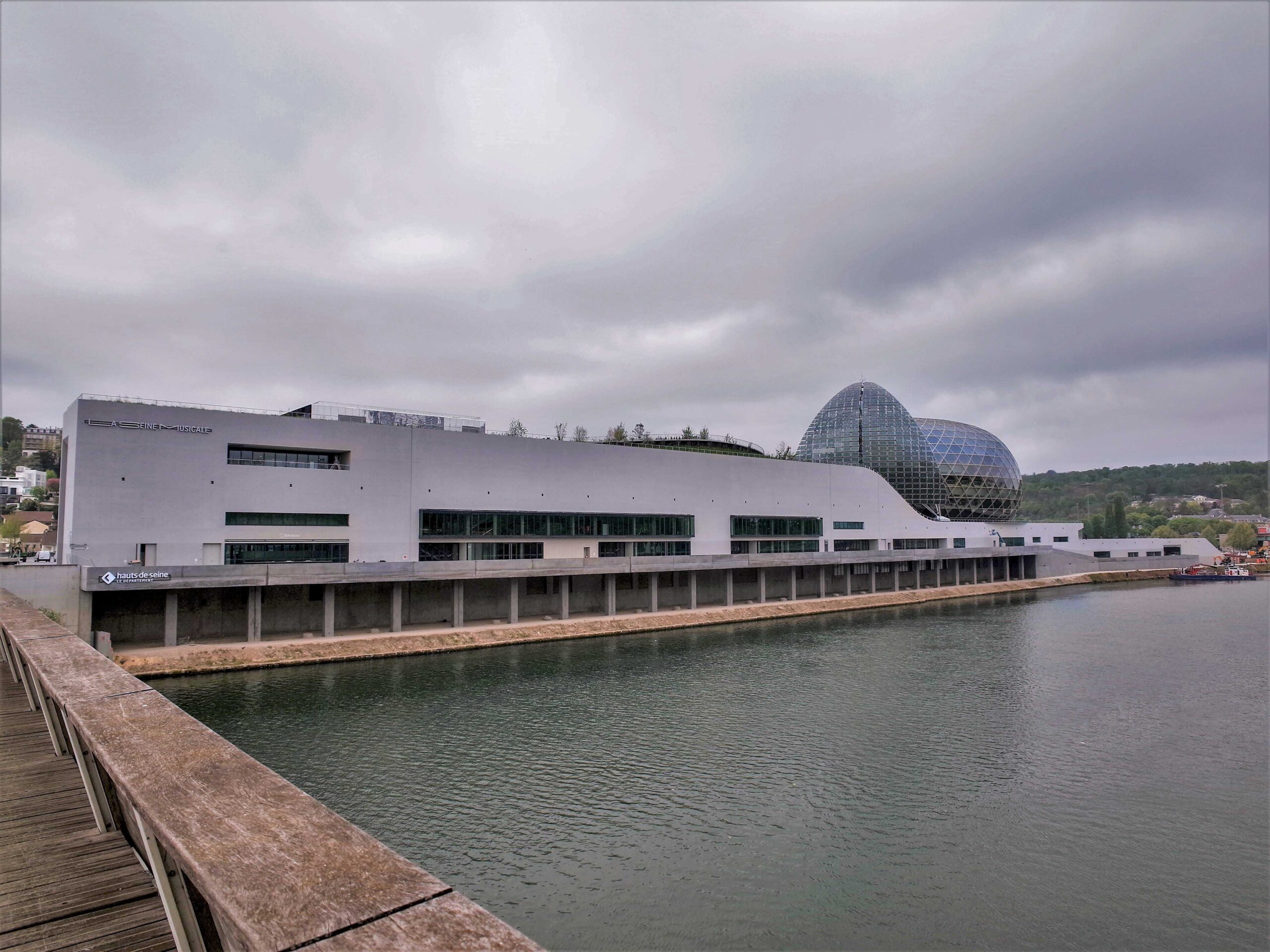 Building approach across the bridge over the River Seine