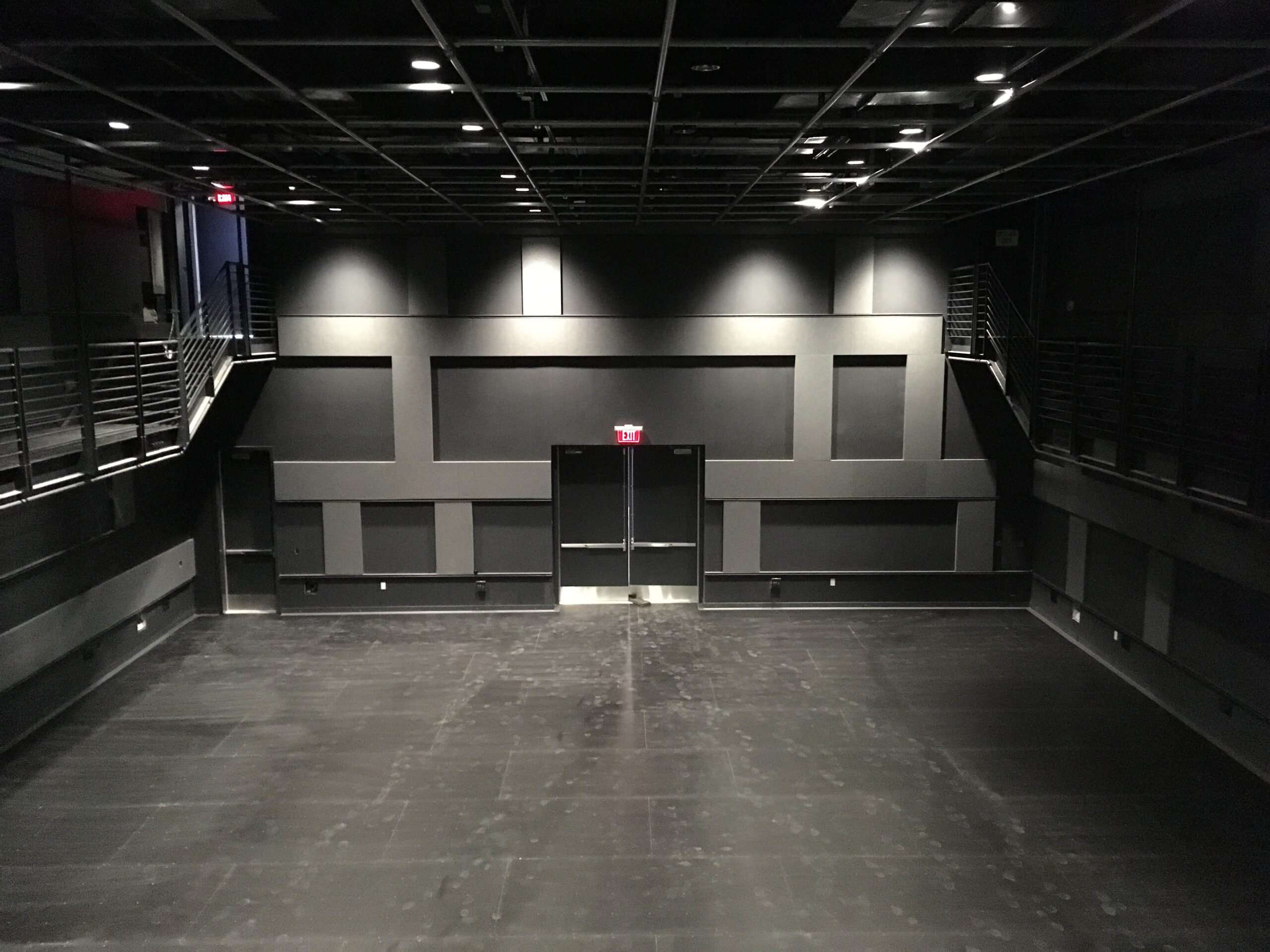 View from studio theater control room with audience seats stored